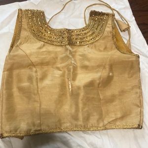 Gold sleeveless lengha / saree blouse